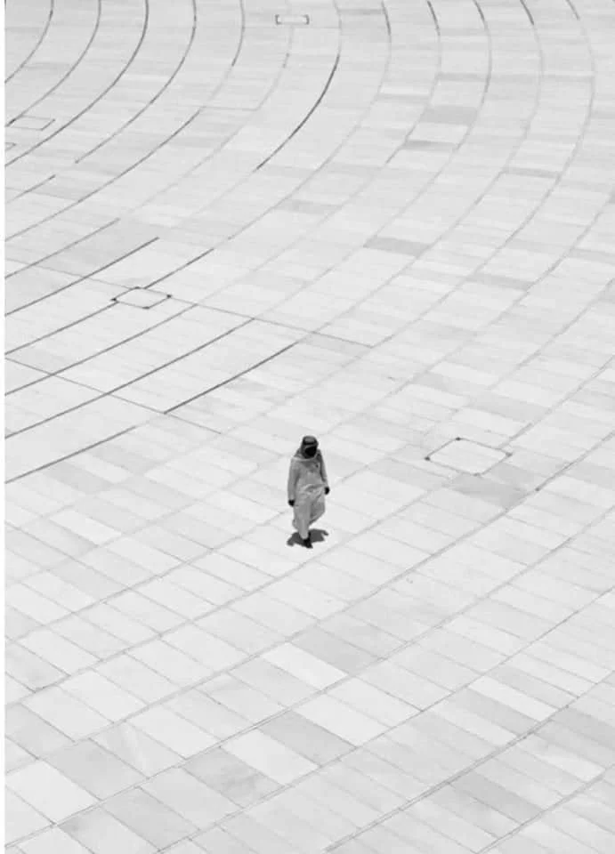 person performing tawaf alone