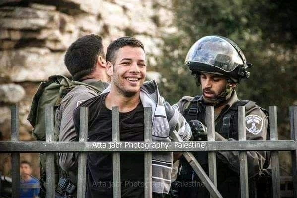 Palestinians Smiling While Getting Arrested 4