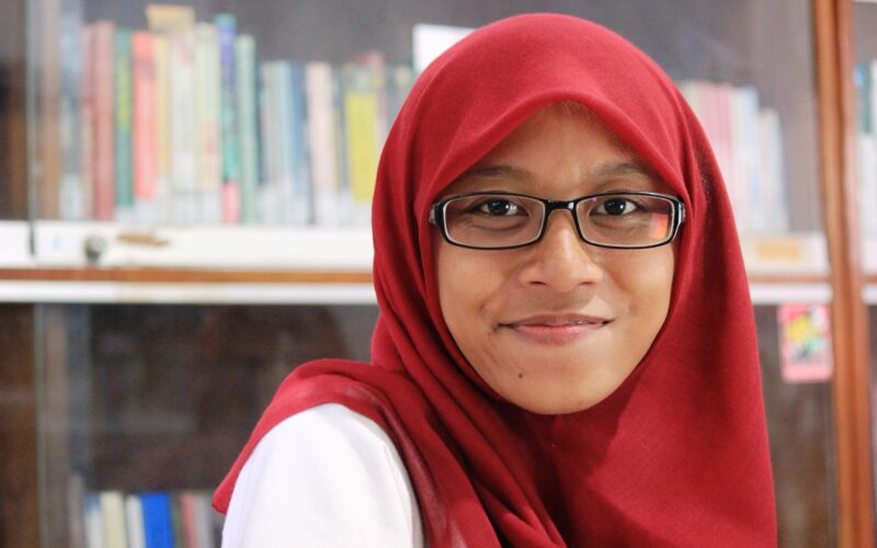 muslim girl in red headscarf