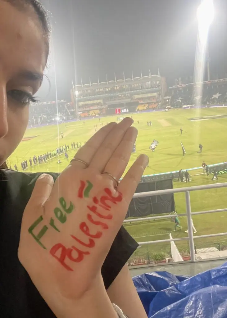 Faryal inside Gaddafi Stadium in Lahore, Pakistan. 'Free Palestine' written on her hand.