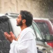 hajj pilgrim makes dua during rain