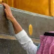 worker perfuming the holy kaaba