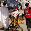 Medical team evacuate a Hajj 2024 pilgrim