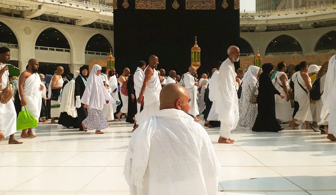 man sitting in the mataaf of Grand mosque