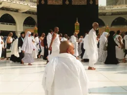 man sitting in the mataaf of Grand mosque