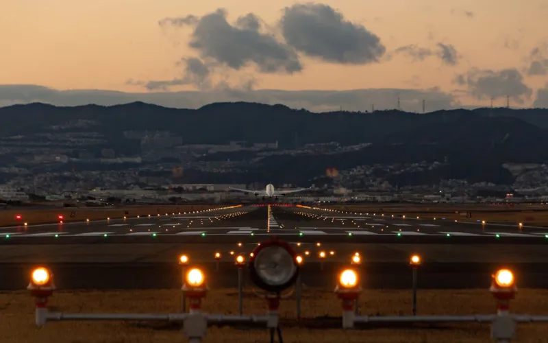 plane taking off at sun set