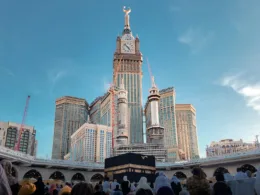 a group of people standing in front of a tall building