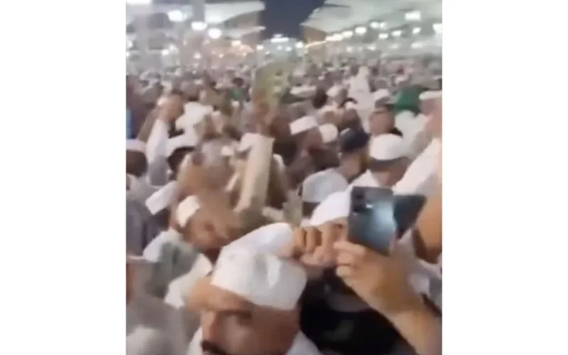 man chanting slogans prophet's mosque