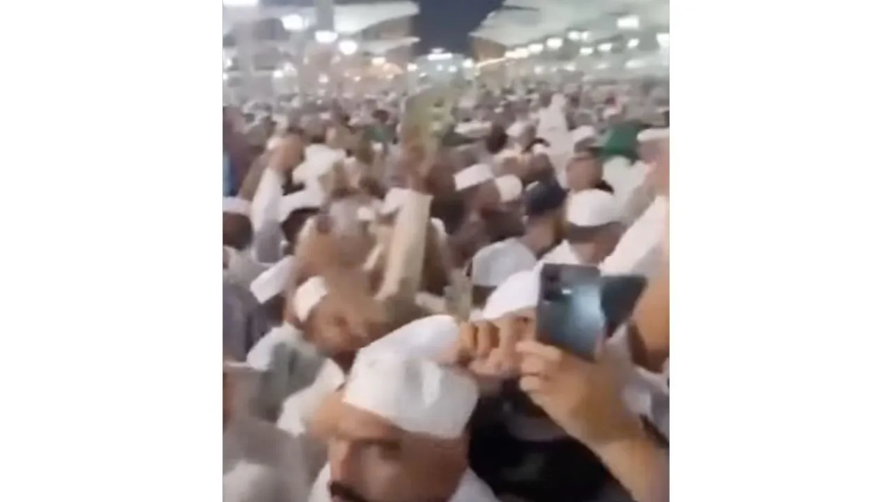 man chanting slogans prophet's mosque