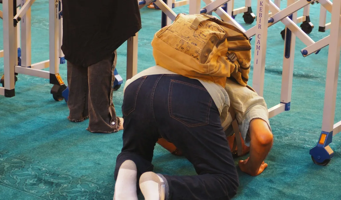 a man kneeling on the ground with a backpack on his head fart