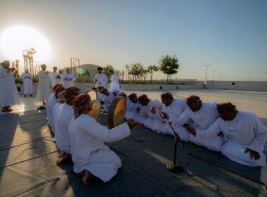 arab man on the ground in the sunset