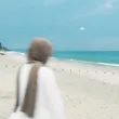 woman in hijab at the beach