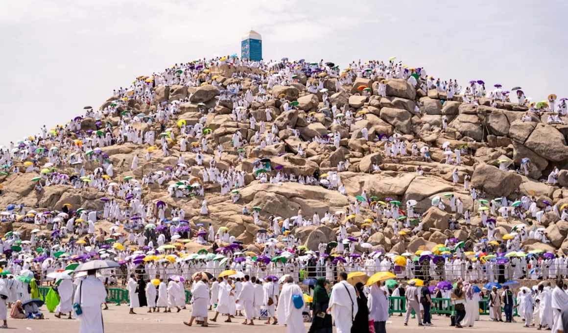 People Walking Beside the Rocky Mountain jabal rahma