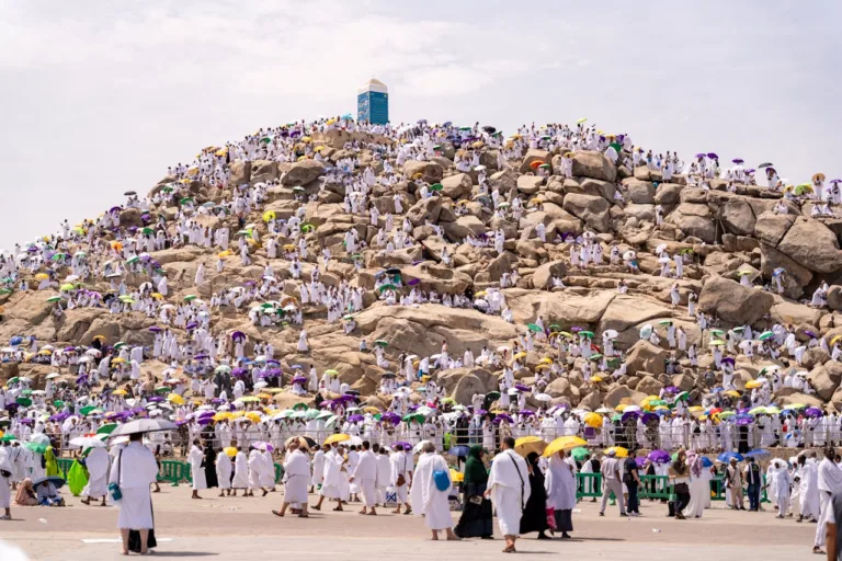 People Walking Beside the Rocky Mountain jabal rahma