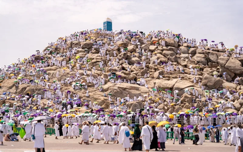 People Walking Beside the Rocky Mountain jabal rahma