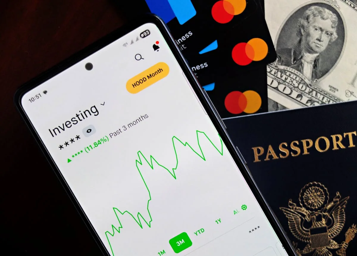 mobile phone with investing app opened on phone