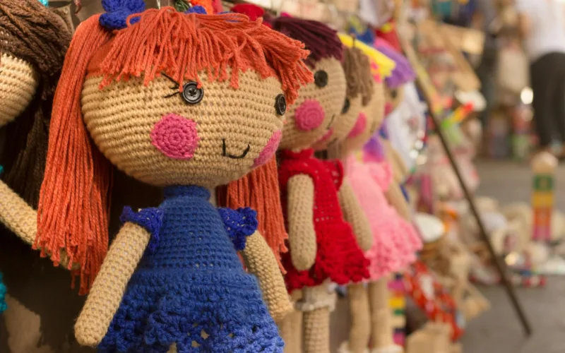 brown purple red knitted doll