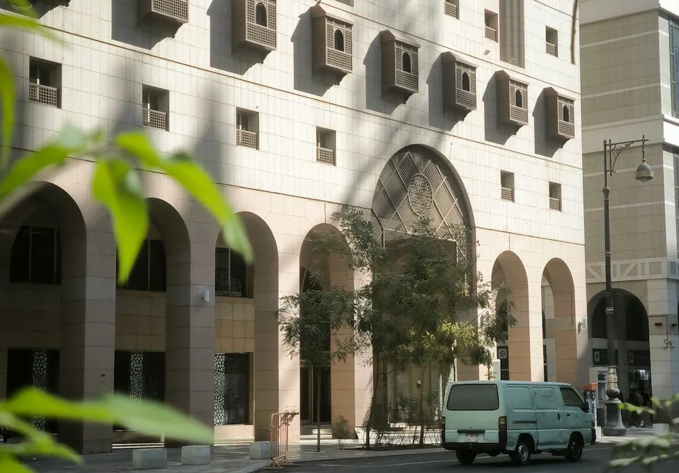 van on street with building near