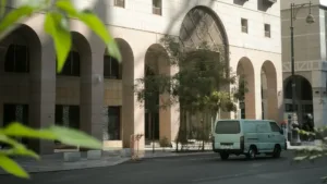 van on street with building near