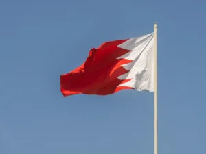 bahrain national flag against clear blue sky