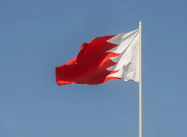 bahrain national flag against clear blue sky
