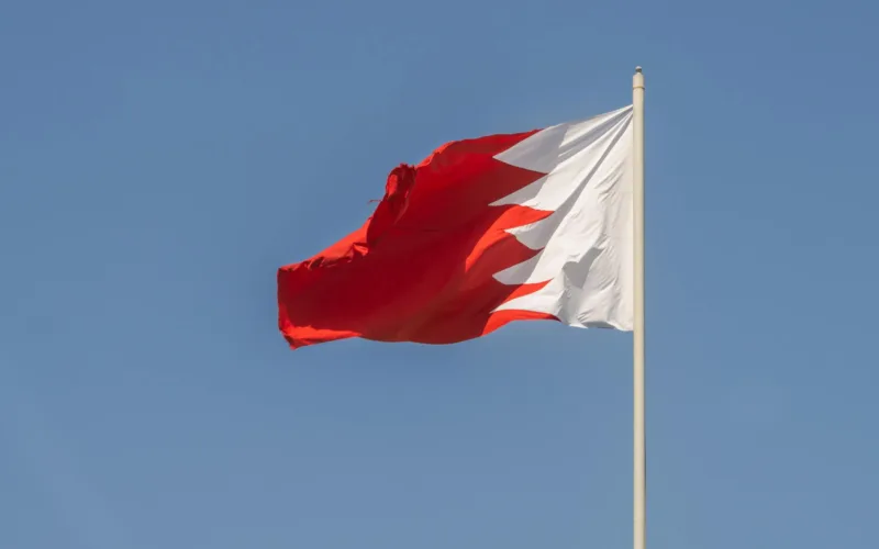 bahrain national flag against clear blue sky