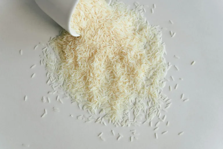 uncooked rice on white surface