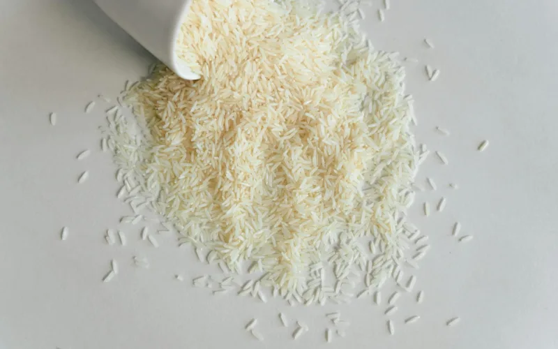 uncooked rice on white surface