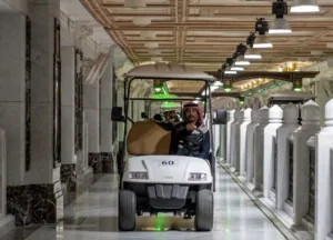 man driving pilgrim cart inside masjid al haram grand mosque in makkah