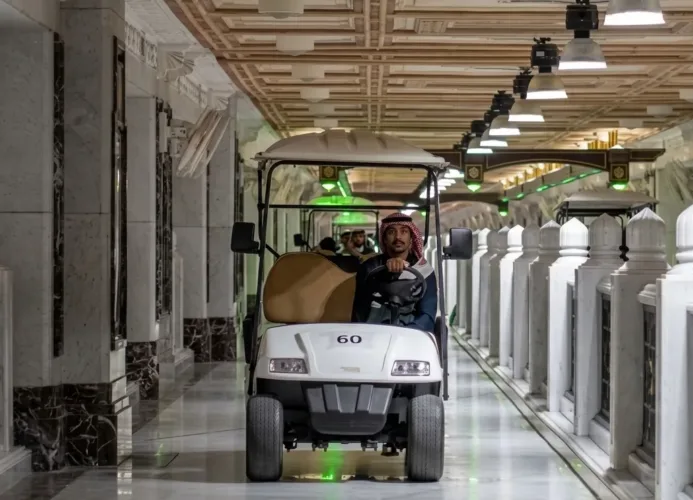 man driving pilgrim cart inside masjid al haram grand mosque in makkah