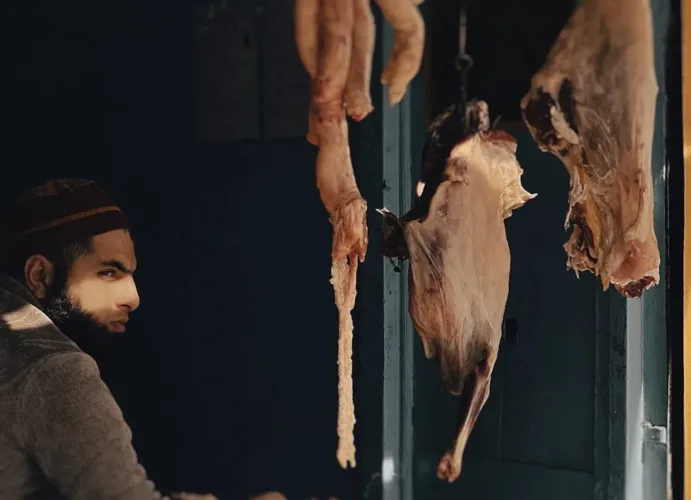 a vendor selling meat in the market