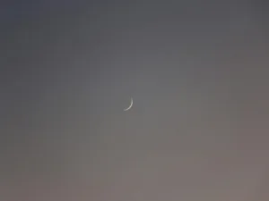 a crescent moon in the sky