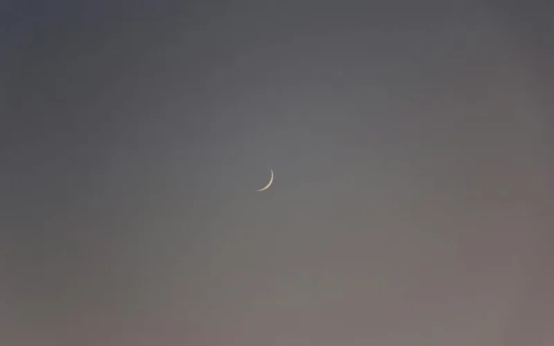 a crescent moon in the sky