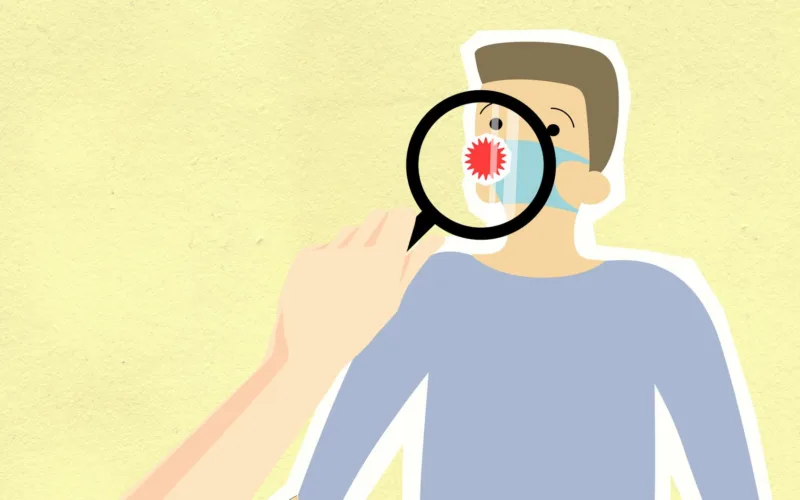 cutout paper illustration of magnifier showing virus on human figure
