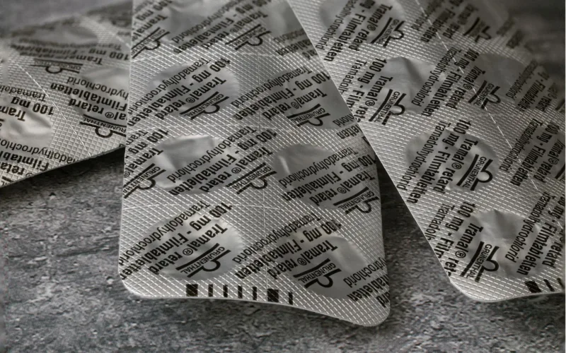 tramadol blister pack on concrete surface