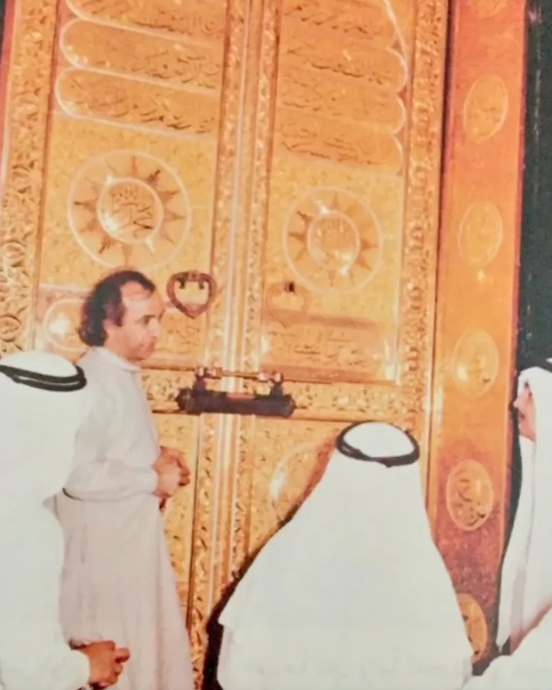 Abdullah Thailand Standing Next To Kaaba Door talking