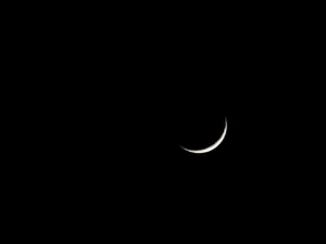crescent on black sky