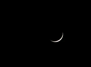 crescent on black sky