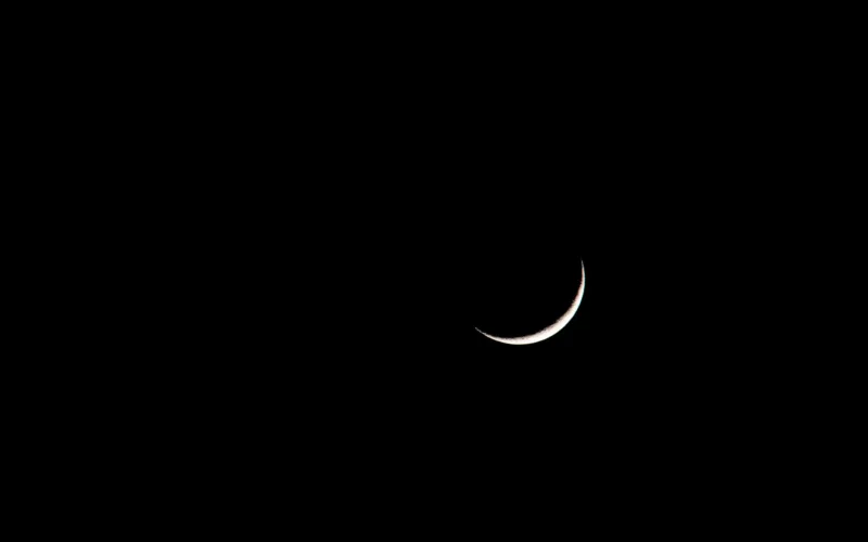 crescent on black sky