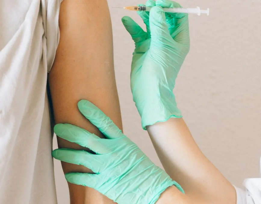a person holding a syringe