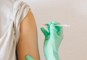 a person holding a syringe
