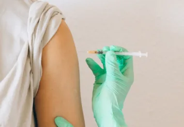 a person holding a syringe