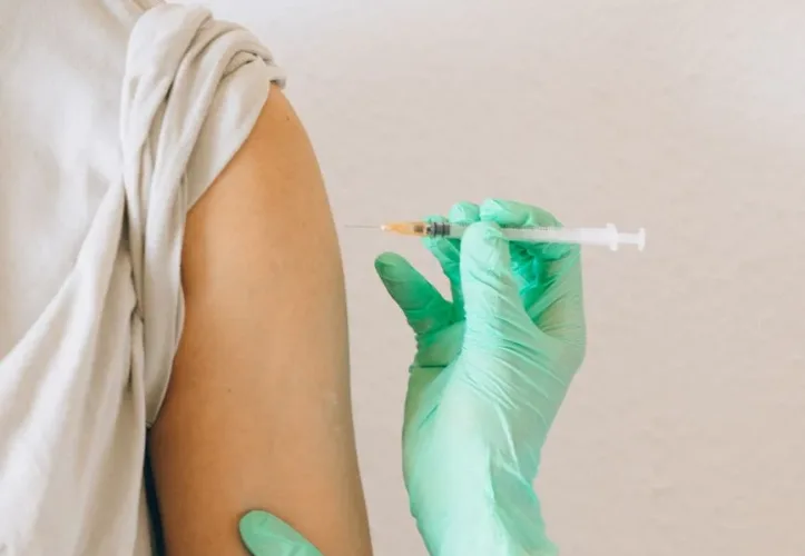 a person holding a syringe