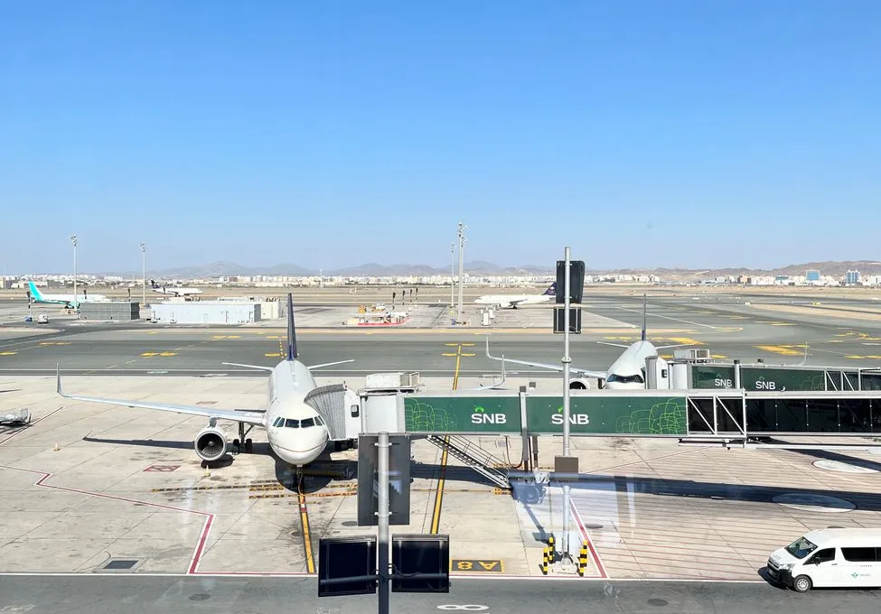 airplane at jeddah airport terminal gate