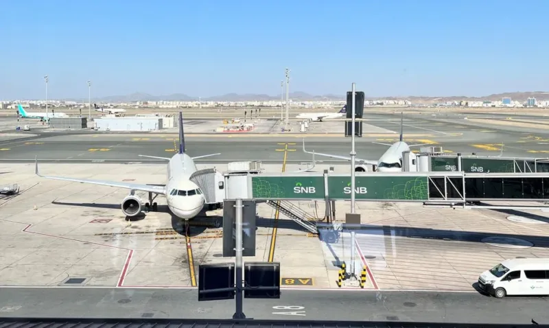 airplane at jeddah airport terminal gate